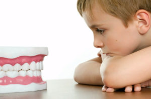 ноет зуб у ребенка фото